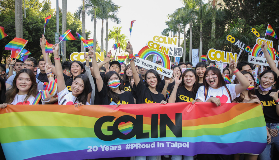 large group of colleagues celebrating at Pride parade