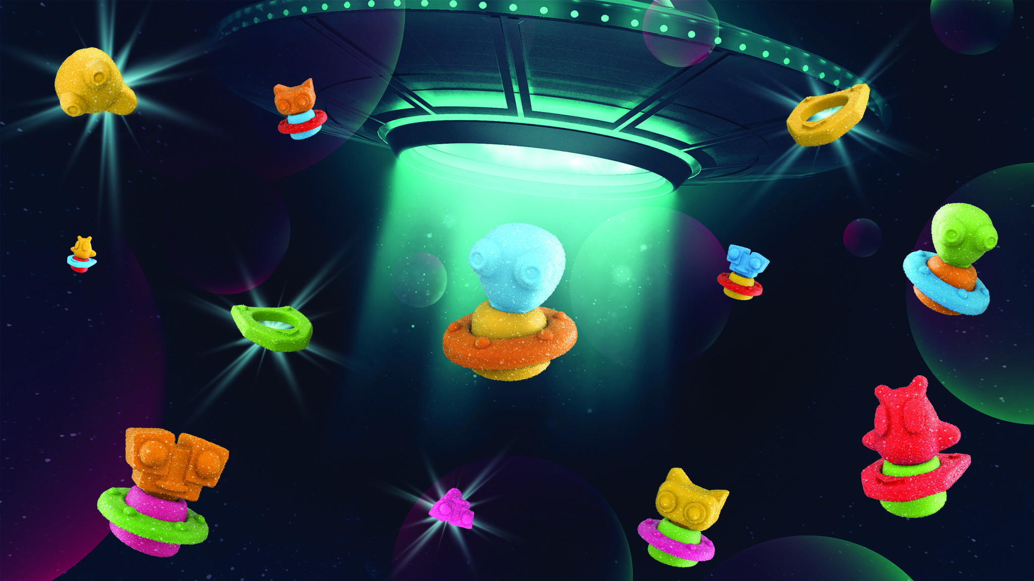 trolli gummy creations scattered about in a space-like setting with a UFO in the middle
