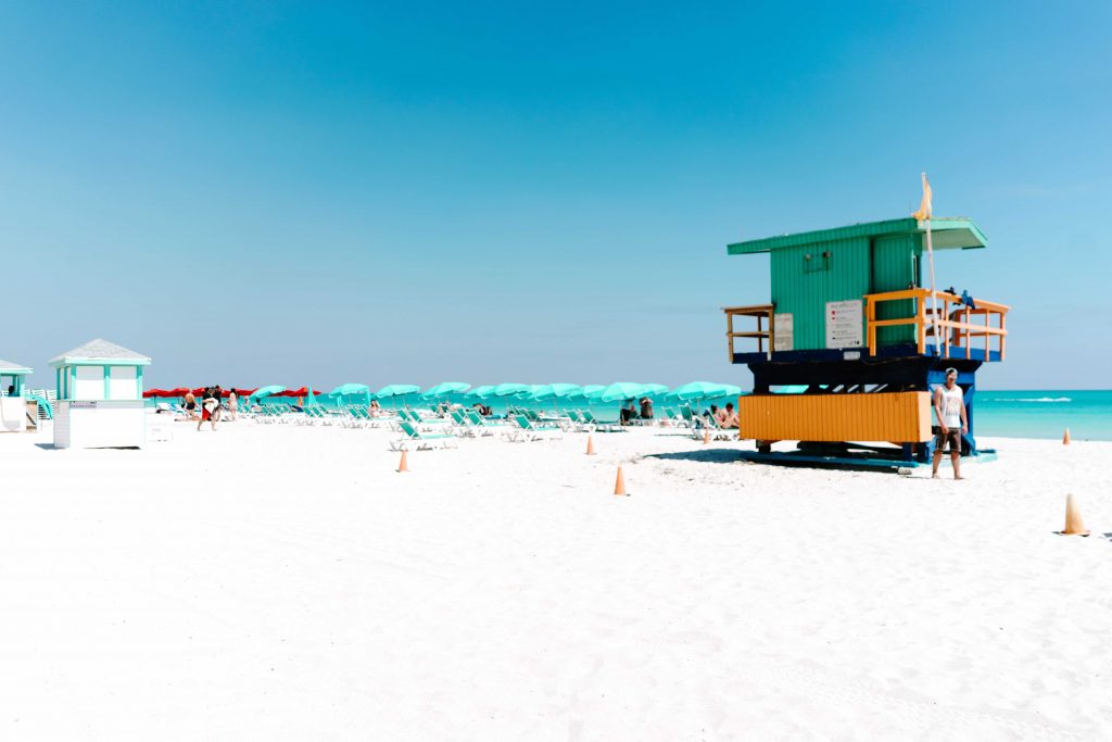 south beach miami lifeguard hut on beach that is turquoise and orange
