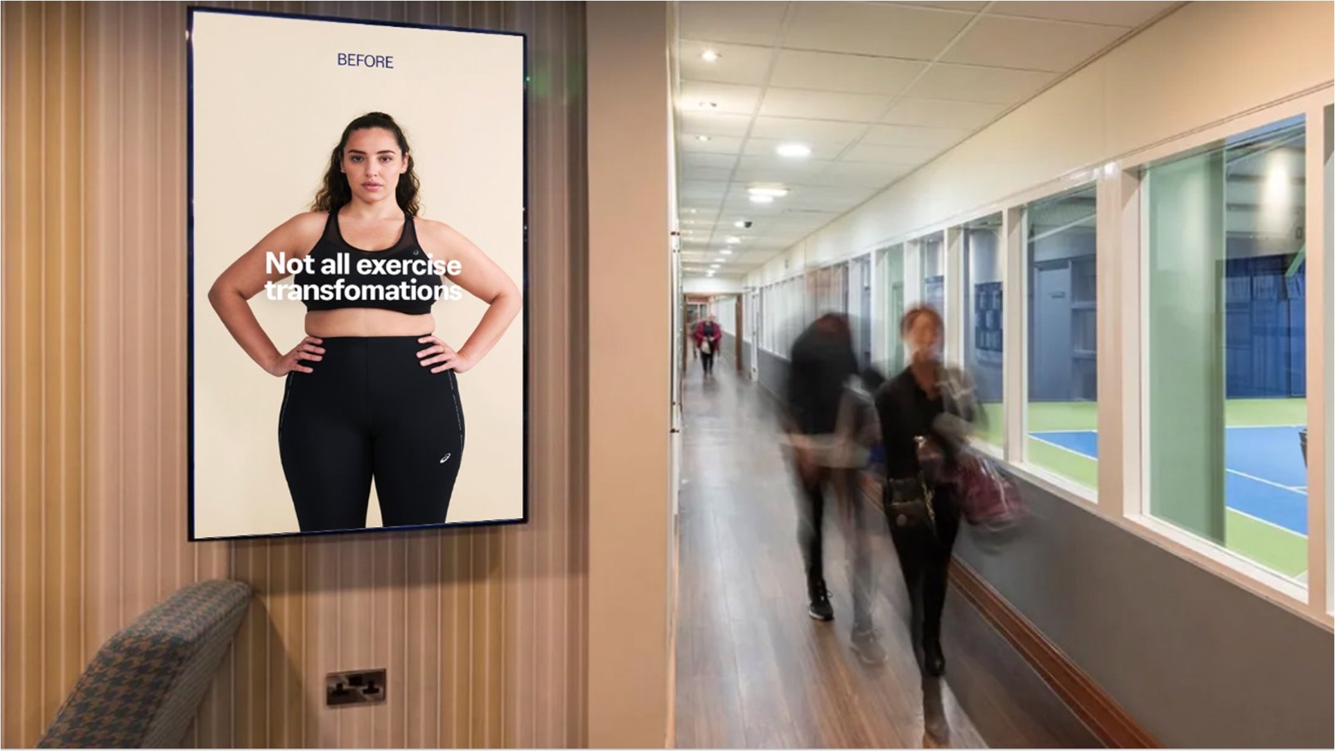 busy hallway in a gym that has a poster with a positive before and after photo