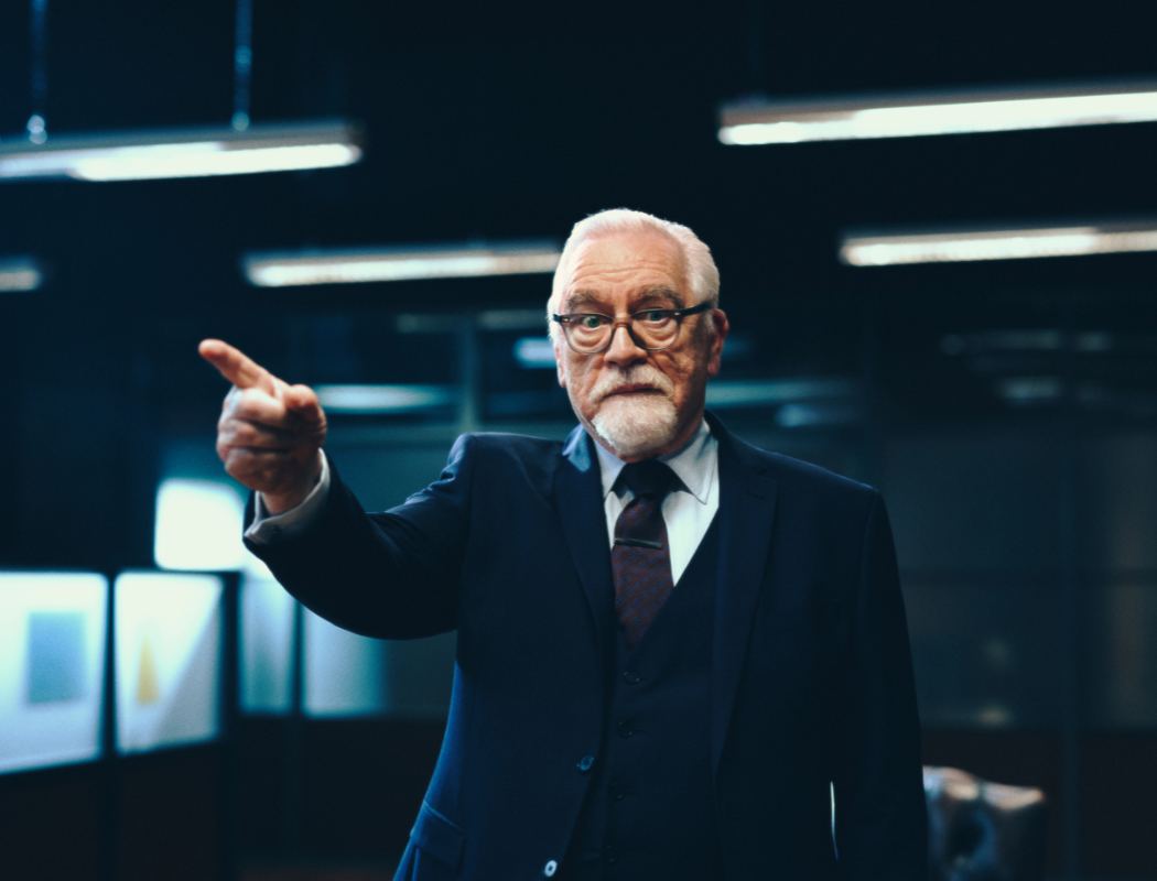 man in suit pointing